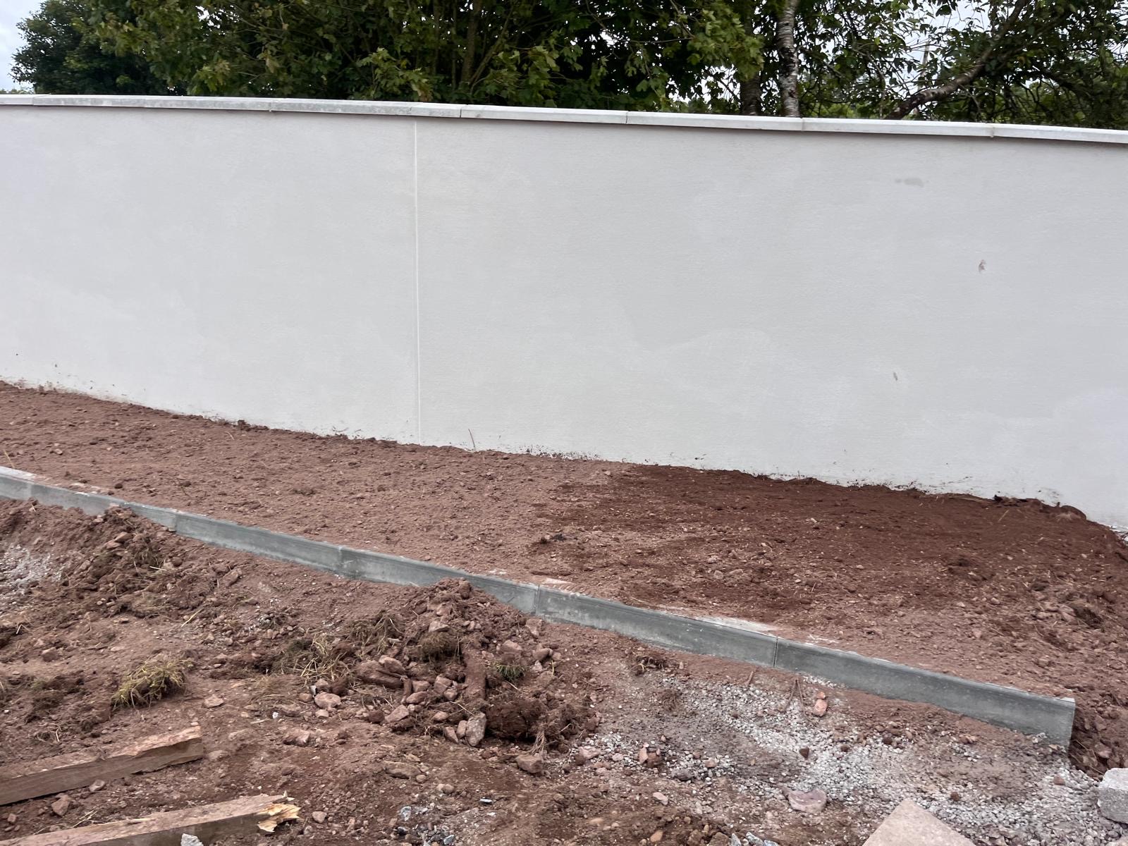 Rendered boundary wall