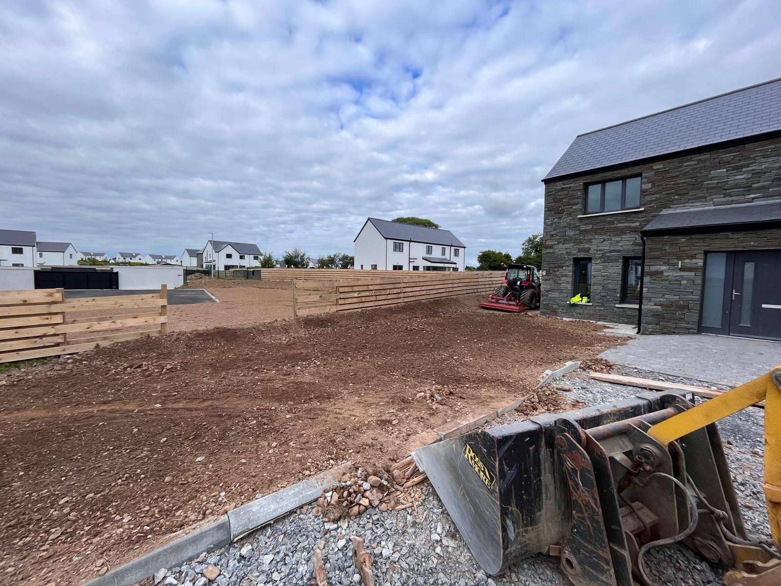 Finished driveway between rendered walls
