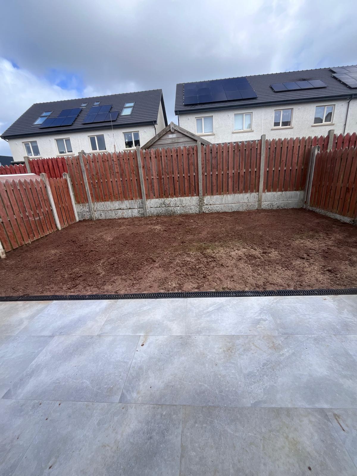 Topsoil laid beside new patio